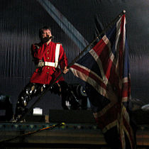 Performing "The Trooper" with Iron Maiden in Paris, France, 1 July 2008. Dickinson has always waved a Union Flag during live renditions of the song.[73]