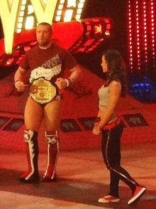 Bryan as World Heavyweight Champion alongside former on-screen girlfriend AJ.