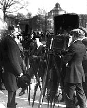 Coolidge, reporters, and cameramen