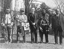 Four Osage men with Coolidge after he signed the bill granting Native Americans across the country American citizenship.