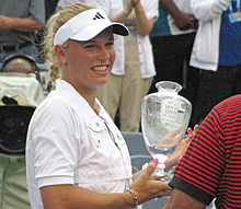 Caroline Wozniacki accepting the winners trophy at the New Haven Open