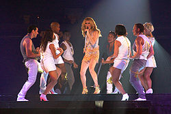 Céline Dion on stage with her dancers performing "River Deep – Mountain High" on the Taking Chances World Tour in September 2008.