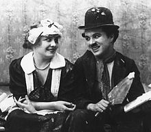 Chaplin and Edna Purviance, his regular leading lady, in Work (1915)