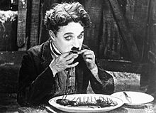 The Tramp resorts to eating his boot in a famous scene from The Gold Rush (1925)