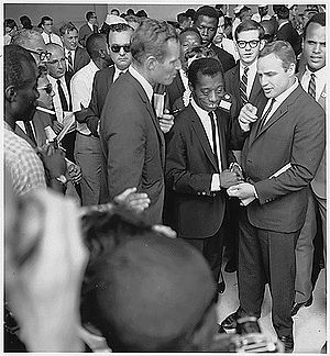 Charlton Heston (left) with James Baldwin, Marlon Brando, and Harry Belafonte at the Civil Rights March on Washington for Jobs and Freedom 1963. Sidney Poitier is in the background.