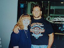 Benoit with a fan during his time in WCW.