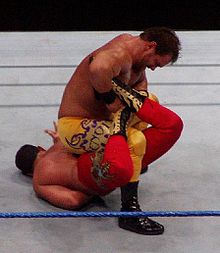 Chris Benoit performing the sharpshooter submission on Chavo Guerrero, Smackdown 2006.