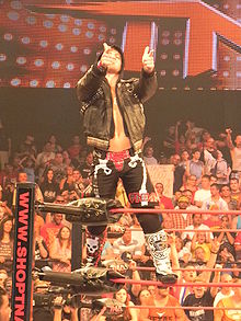 Sabin posing on the turnbuckles during his ring entrance.