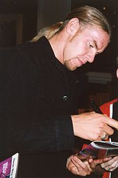 Christian signing autographs in 1999