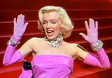 Marilyn Monroe performing "Diamonds Are a Girl's Best Friend" in the film Gentlemen Prefer Blondes. The song was also performed by Aguilera in Burlesque