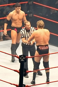 Cody Rhodes looks on as the referee admonishes William Regal during a bout in late 2007