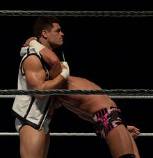 Rhodes setting up the Cross Rhodes on Tyson Kidd.