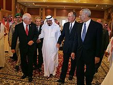 Powell walks with newly crowned King Abdullah of Saudi Arabia, Vice President Dick Cheney, and former President George H. W. Bush, Saudi Arabia, August 2005.