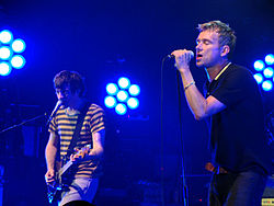 Coxon (left) and Albarn on stage at the Newcastle Academy in June 2009.