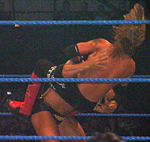 Batista performing a spinebuster to Edge.