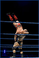 Batista delivering a suplex to Chris Jericho in September 2009.
