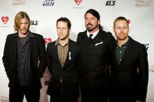 Foo Fighters in 2009, from left to right: Hawkins, Shiflett, Grohl, Mendel