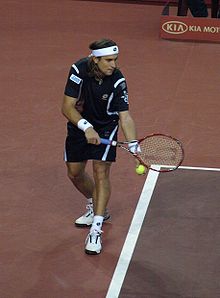 David Ferrer serving during the 2007 Tennis Masters Cup.