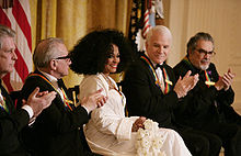 Diana Ross is applauded by her fellow Kennedy Center honorees as she is recognized for her career achievements by President George W. Bush in the East Room of the White House Sunday, Dec. 2, 2007, during the Kennedy Center Gala Reception. From left to right: singer-songwriter Brian Wilson; filmmaker Martin Scorsese; Ross; comedian, actor and author Steve Martin, and pianist Leon Fleisher.